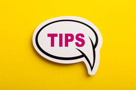 Tips speech bubble isolated on the yellow background.の写真素材