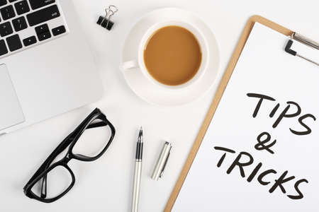 Tips And Tricks concept on desktop workspace with office supplies.の写真素材