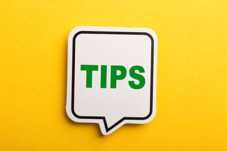 Tips speech bubble isolated on the yellow background.の写真素材