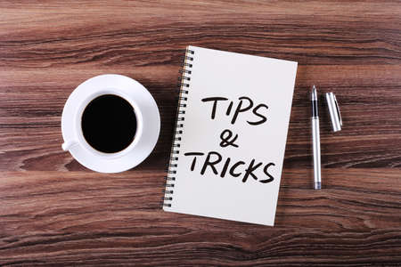 Tips And Tricks concept on desktop workspace with office supplies.の写真素材