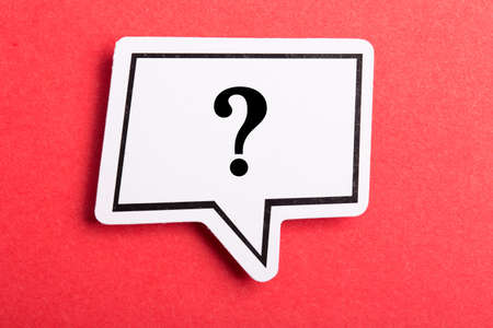 Question mark speech bubble isolated on red background.の写真素材