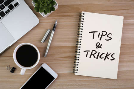 Tips And Tricks concept on desktop workspace with office supplies.の写真素材