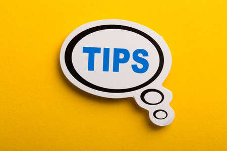 Tips speech bubble isolated on the yellow background.の写真素材