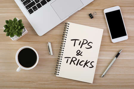 Tips And Tricks concept on desktop workspace with office supplies.の写真素材