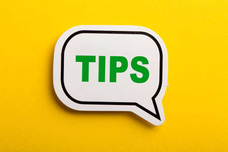 Tips speech bubble isolated on the yellow background.の写真素材