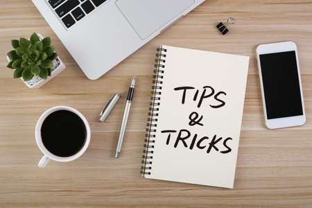 Tips And Tricks concept on desktop workspace with office supplies.の写真素材