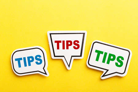 Tips speech bubble isolated on the yellow background.の写真素材