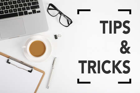 Tips And Tricks concept on desktop workspace with office supplies.の写真素材