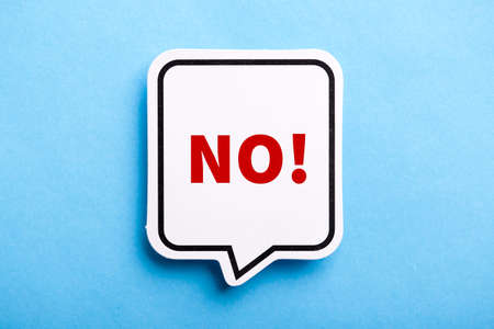 Say No white speech bubble isolated on blue background.の写真素材