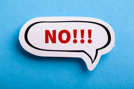 Say No white speech bubble isolated on blue background.の写真素材