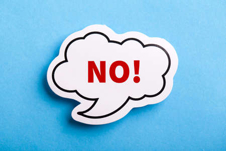 Say No white speech bubble isolated on blue background.の写真素材