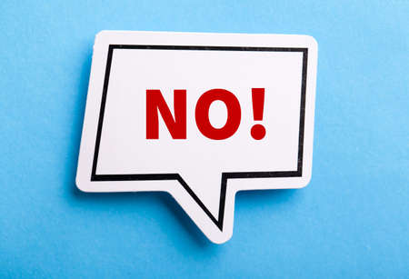 Say No white speech bubble isolated on blue background.の写真素材