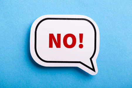 Say No white speech bubble isolated on blue background.の写真素材