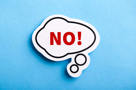 Say No white speech bubble isolated on blue background.の写真素材