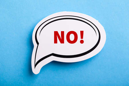 Say No white speech bubble isolated on blue background.の写真素材