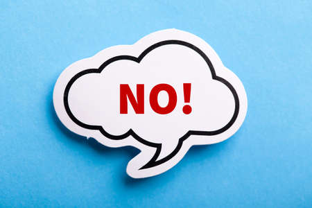 Say No white speech bubble isolated on blue background.の写真素材