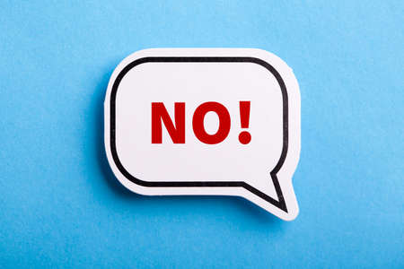 Say No white speech bubble isolated on blue background.の写真素材