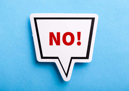 Say No white speech bubble isolated on blue background.の写真素材
