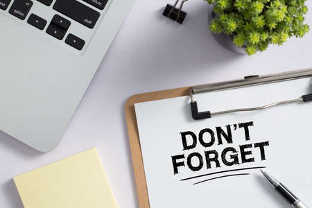 Do Not Forget Concept reminder on office desktop top view.の写真素材