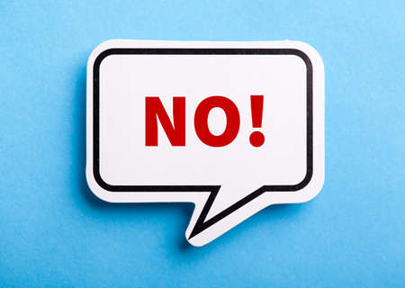 Say No white speech bubble isolated on blue background.の写真素材