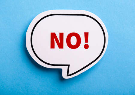 Say No white speech bubble isolated on blue background.の写真素材