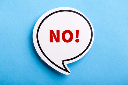 Say No white speech bubble isolated on blue background.の写真素材