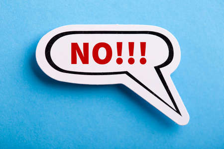 Say No white speech bubble isolated on blue background.の写真素材