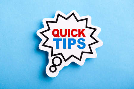 Quick Tips Concept speech bubble isolated on blue background.の写真素材