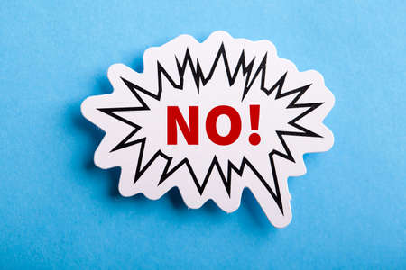 Say No white speech bubble isolated on blue background.の写真素材