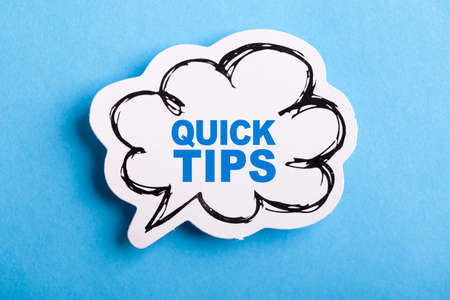 Quick Tips Concept speech bubble isolated on blue background.の写真素材