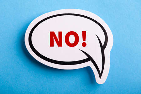 Say No white speech bubble isolated on blue background.の写真素材