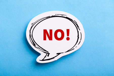 Say No white speech bubble isolated on blue background.の写真素材