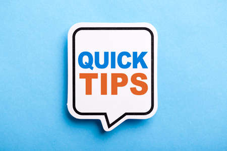 Quick Tips Concept speech bubble isolated on blue background.の写真素材
