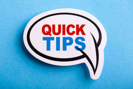 Quick Tips Concept speech bubble isolated on blue background.の写真素材
