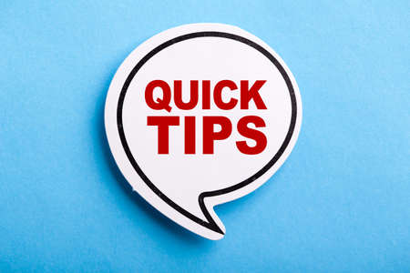 Quick Tips Concept speech bubble isolated on blue background.の写真素材