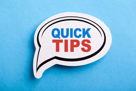 Quick Tips Concept speech bubble isolated on blue background.の写真素材
