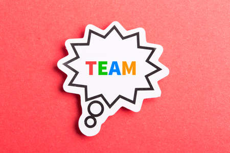 Team colorful text speech bubble isolated on red background about Teamwork concept.の写真素材