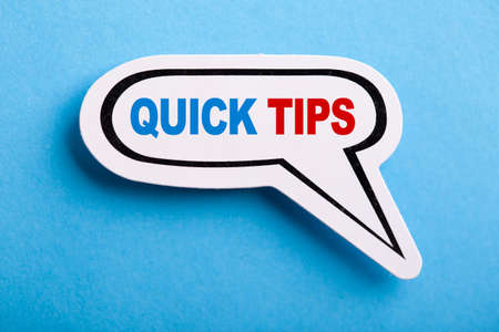 Quick Tips Concept speech bubble isolated on blue background.の写真素材