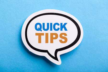 Quick Tips Concept speech bubble isolated on blue background.の写真素材