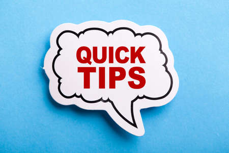 Quick Tips Concept speech bubble isolated on blue background.の写真素材