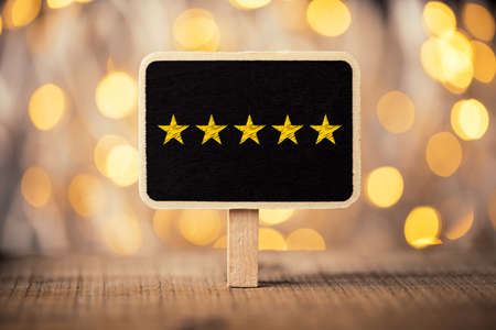 Five yellow stars concept black sign billboard isolated.の写真素材