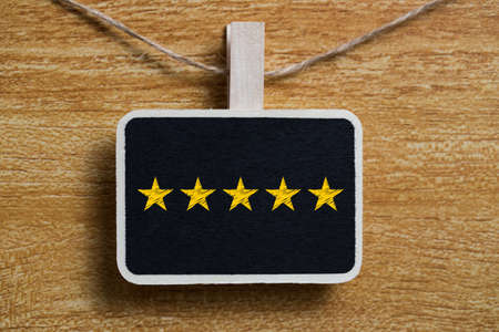 Five yellow stars concept black sign billboard isolated.の写真素材