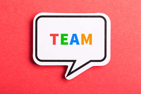 Team colorful text speech bubble isolated on red background about Teamwork concept.の写真素材