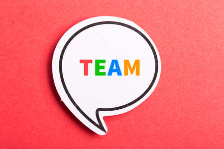 Team colorful text speech bubble isolated on red background about Teamwork concept.の写真素材