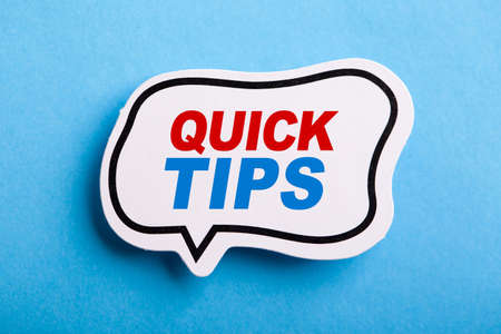 Quick Tips Concept speech bubble isolated on blue background.の写真素材