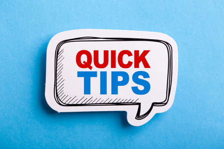 Quick Tips Concept speech bubble isolated on blue background.の写真素材