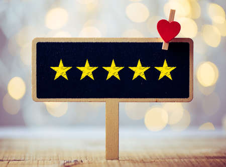 Five yellow stars concept black sign billboard isolated.の写真素材