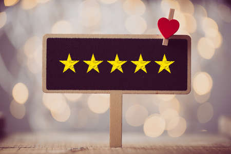 Five yellow stars concept black sign billboard isolated.の写真素材