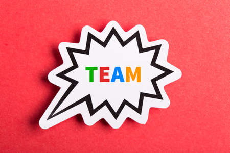 Team colorful text speech bubble isolated on red background about Teamwork concept.の写真素材