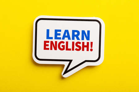 Learn English speech bubble isolated on the yellow background.の写真素材